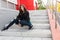 Urban student girl posing in a leather jacket outdoors in the city