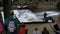 Urban surfers ride the standing wave on the Eisbach River, Munich, Germany