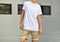 Urban template of clothes with yong man in a blank T-shirt and