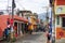 Urban view of a busy narrow street with traditional shops in a  village in Guatemala