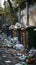 Urban waste problem garbage containers and bags strewn across street