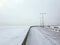 Urban winter landscape with an empty embankment