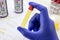 Urine bottle held by healthcare professionals with latex glove, toxicology test