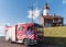 Urk Flevoland Netherlands April 2017, New Dutch red fire truck,fire engine standing in font of the lighthouse with