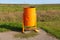 Urn from a fuel barrel on the side of the road