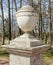 An urn on the pedestal in the Pavlovsk park.