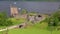 Urquhart Castle and Loch Ness, Scotland Scenic View with Boats Passing By