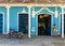 Urquoise blue and white facade of old colonial building in Trinidad, Cuba