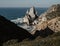 Ursa Beach Sea stack, Portugal. Atlantic Ocean Foamy waves rolling to rocks. Holiday vacation landscape scene