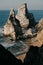 Ursa Beach Sea stack, Portugal. Atlantic Ocean Foamy waves rolling to rocks. Holiday vacation landscape scene