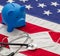 US of America health budget. Medical stethoscope, protective mask and piggy bank on a USA flag, closeup view