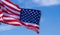 US American flag on blue sky background. For USA Memorial day, Veterans day, Labor day, or 4th of July celebration. Top view, copy