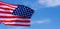 US American flag on blue sky background. For USA Memorial day, Veterans day, Labor day, or 4th of July celebration. Top view, copy