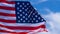 US American flag on blue sky background. For USA Memorial day, Veterans day, Labor day, or 4th of July celebration. Top view, copy