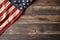 US American flag on wooden background. For USA Memorial day, Veteran`s day, Labor day, or 4th of July celebration. With blank