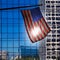 US american symbol flag over blue modern LA buildings