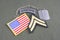 US ARMY Corporal rank patch, airborne tab, flag patch and dog tag on olive green uniform