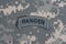 US ARMY ranger tab on camouflage uniform