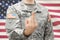 US Army young soldier showing middle finger of his left hand