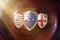Us Australia and Great Britain flags in golden shield on copper texture background.aukus defense pact