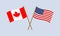 US and Canada crossed flags on stick. American and Canadian national symbols. Vector illustration