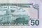 US Capitol on 50 dollars banknote back side closeup macro fragment. United states fifty dollars money bill