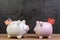 US and China trade war or tariffs negotiation concept, piggy bank with United state national flag face to face with one with China