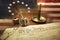 US Constitution with quill pen, glasses, candle, ink and flag