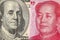 US dollar bill and China yuan banknote macro