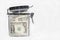 US dollar bills in a kitchen storage jar, saving money concept