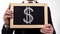 US dollar symbol on blackboard in businessman hands, world currency, finance