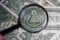 US dollar viewed through a magnifying glass, close up detail of the pyramid. Masonic symbols.