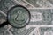 US dollar viewed through a magnifying glass, close up detail of the pyramid. Masonic symbols.