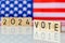 US elections 2024, American flag and the inscription VOTE 2024. The concept of voting in the United States in 2024