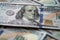 US fiat money pile, hundred dollar bills with Franklin closeup