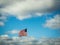 US Flag Flying in Blue, Cloudy Sky