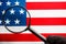 US flag looking through a magnifying glass. Study of the history and culture of the country of the United States. The concept of