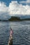 US Flag on Rotting Mooring Point with Island in Distance