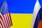 The US flag and Russian flag on the background of the Ukraine flag. Flag of USA, Russia and Ukraine. The United States of America