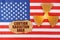 On the US flag, the symbol of radioactivity and torn cardboard with the inscription - caution radiation area