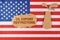 On the US flag there is an oil rig cut out of cardboard and a sign with the inscription - oil export restrictions