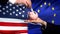 US investment in EU, hand putting money in piggybank on flag background, finance