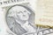 US one dollar bill with image / portrait of George Washington and gold bullion.