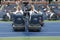 US Open cleaning crew drying tennis court after rain delay at Arthur Ashe Stadium