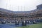 US Open cleaning crew drying tennis court after rain delay at Arthur Ashe Stadium