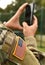 US soldier make a photo on his smartphone