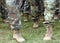 US soldiers legs in green camouflage military uniform. US troops