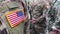 US soldiers. US army. USA patch flag on the US military uniform. Soldiers on the parade ground from the back.