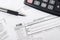 US tax form 1120 with pen and calculator