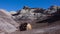 USA,  Arizona - November 17, 2019: The Painted Desert on a sunny day. Photographer on a background of multi-colored clay mountains